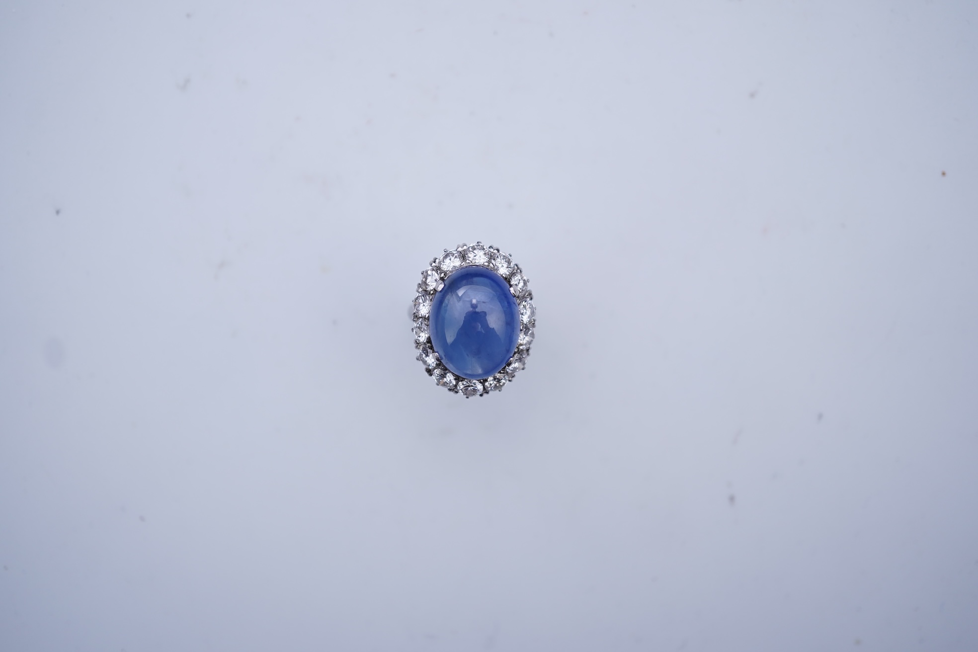 A sapphire and diamond ring, mid 20th century